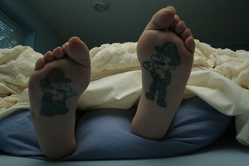Mario, who painted on the right foot, is depicted to be short and plump 