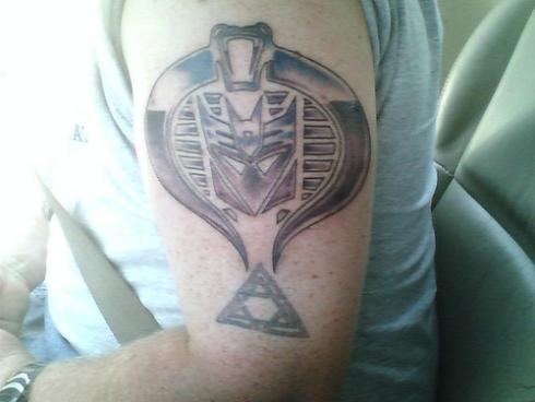 transformers tattoo with cobra. I wonder what next could be the artist's 