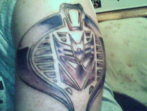 transformers tattoo with gi joe. This tattoo looks especially detailed and 
