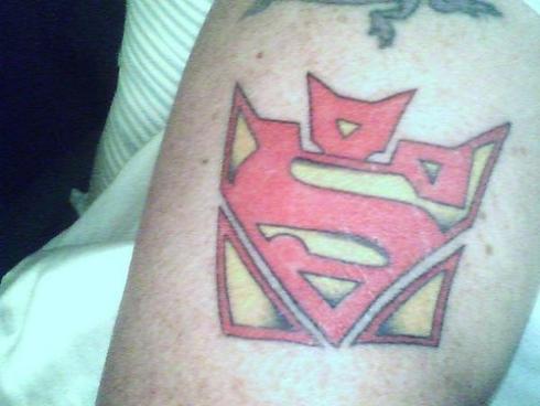 transformers tattoo with superman. Whoever said getting a tattoo was the 
