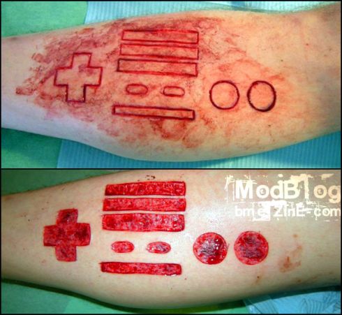 OMG a conch scar tattoo. tatto-scar. This Nintendo Logo Tattoo is just right 
